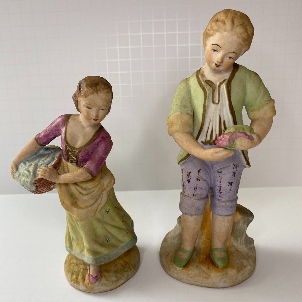 Vintage bisque porcelain figurines pair Girl basket Boy grapes boy 7.5"